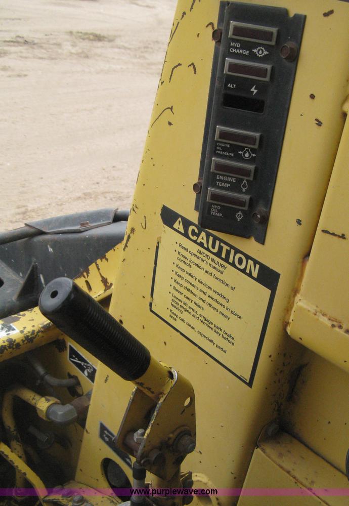 image for item E3024 New Holland L785 skid steer