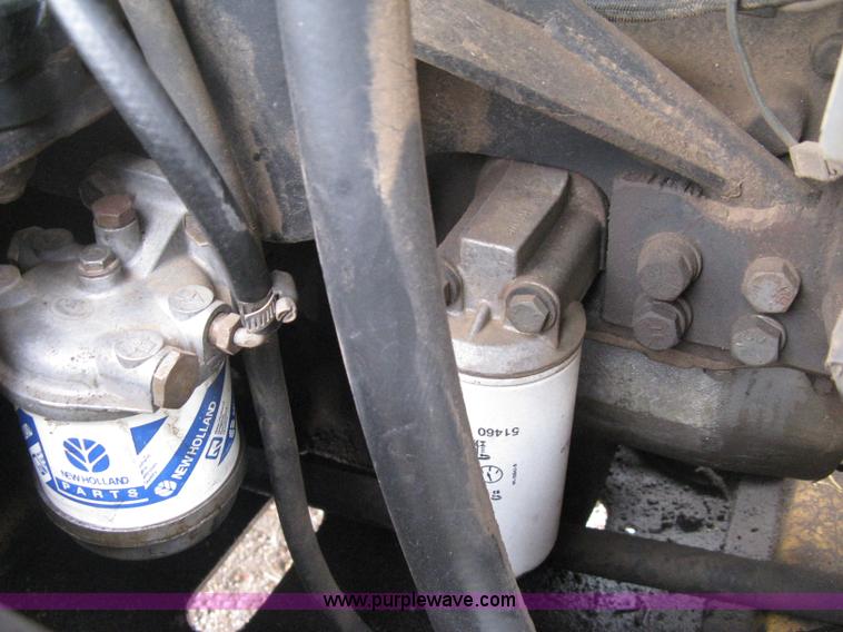 image for item E3024 New Holland L785 skid steer