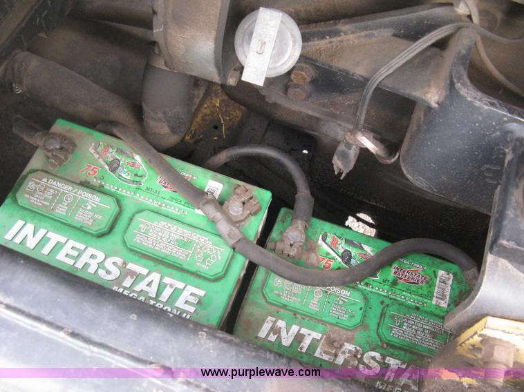 image for item E3024 New Holland L785 skid steer