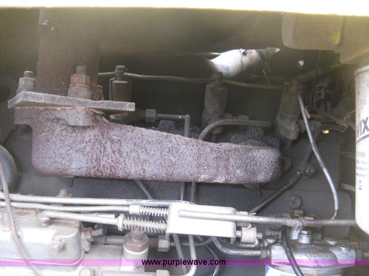 image for item E3024 New Holland L785 skid steer