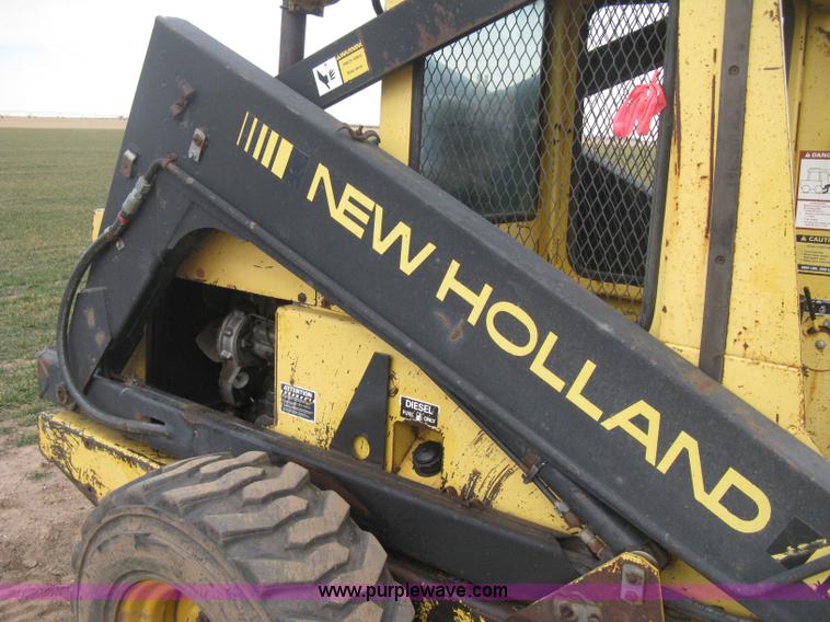 image for item E3024 New Holland L785 skid steer