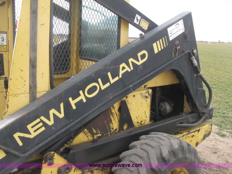 image for item E3024 New Holland L785 skid steer