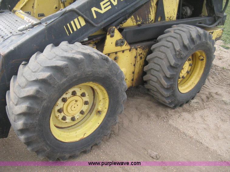 image for item E3024 New Holland L785 skid steer