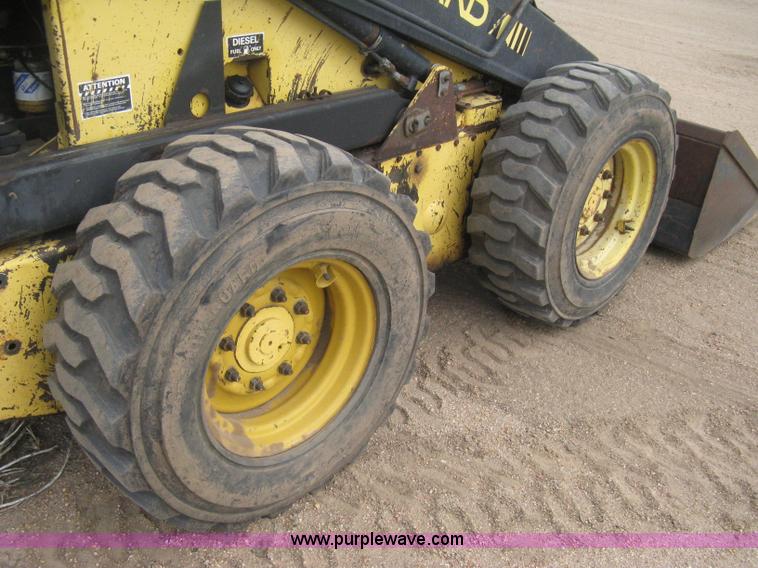 image for item E3024 New Holland L785 skid steer