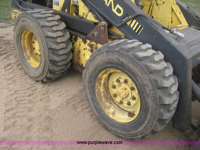 image for item E3024 New Holland L785 skid steer