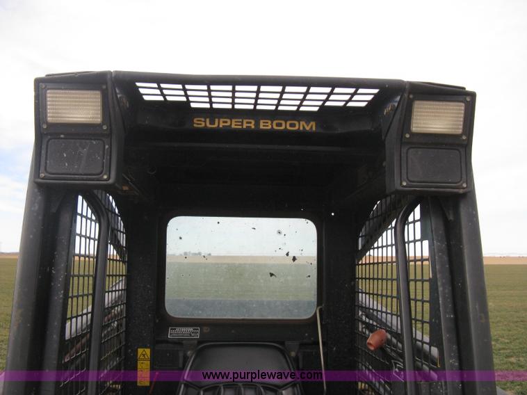 image for item E3025 1997 New Holland LX885 Turbo skid steer