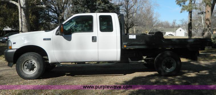 image for item G7537 2004 Ford F350 XL Super Duty flatbed pickup truck