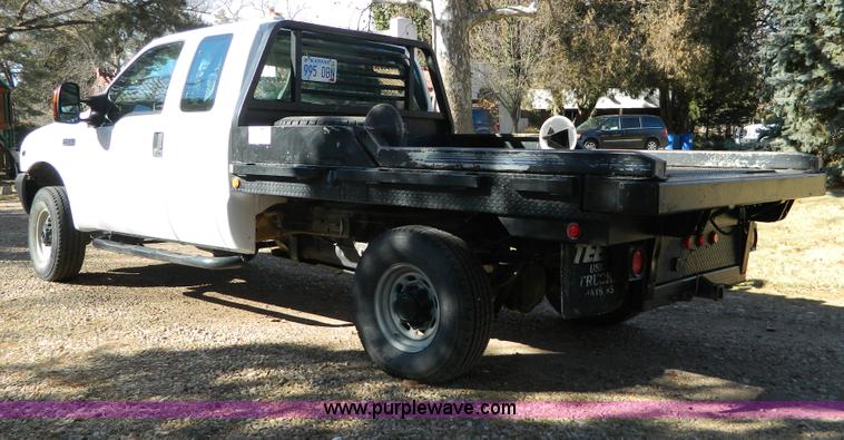 image for item G7537 2004 Ford F350 XL Super Duty flatbed pickup truck