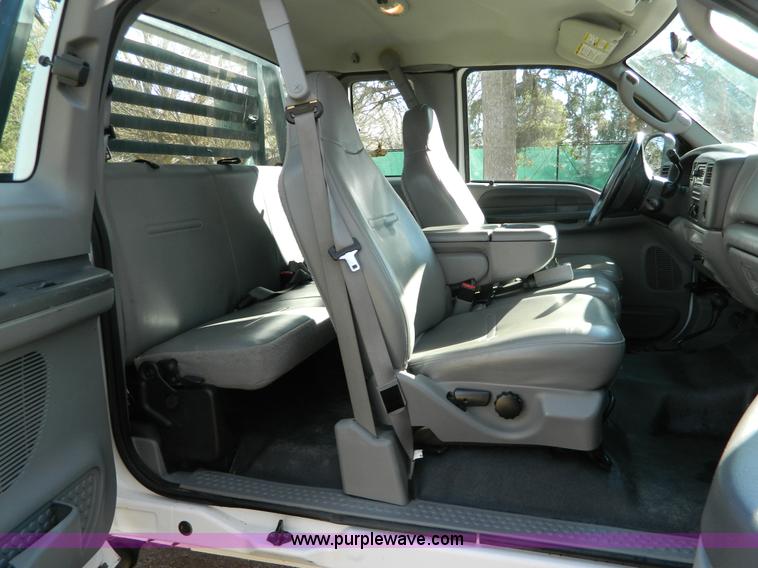 image for item G7537 2004 Ford F350 XL Super Duty flatbed pickup truck