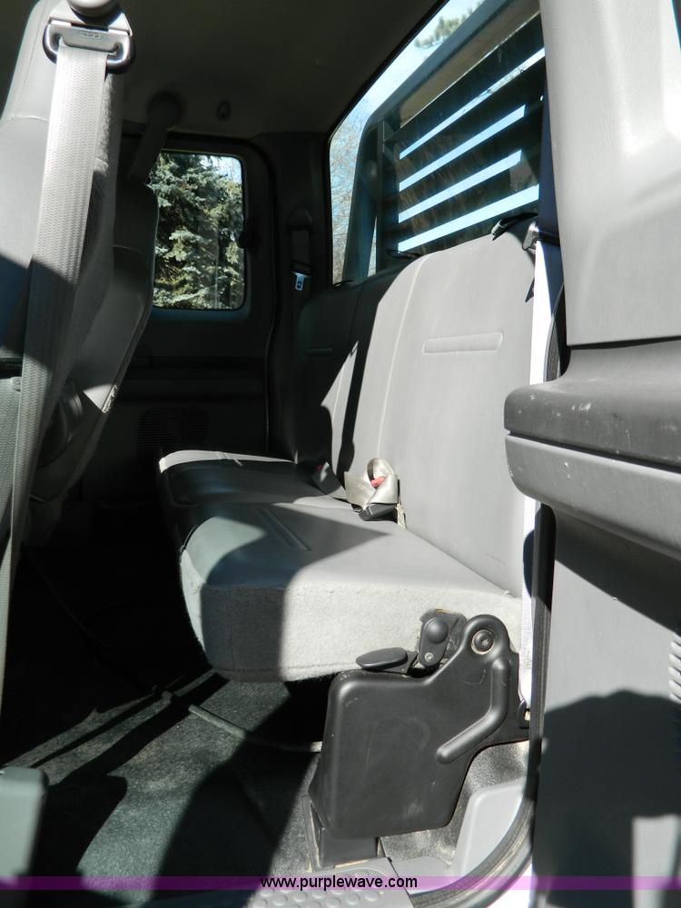 image for item G7537 2004 Ford F350 XL Super Duty flatbed pickup truck