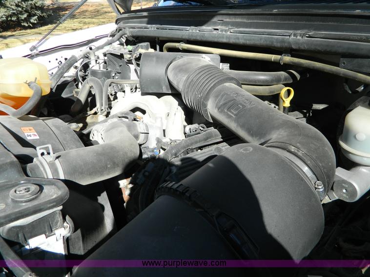 image for item G7537 2004 Ford F350 XL Super Duty flatbed pickup truck