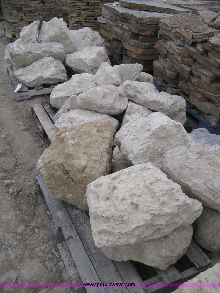 3 pallets of various size limestone boulders in Wichita, KS Item AK9067 sold Purple Wave