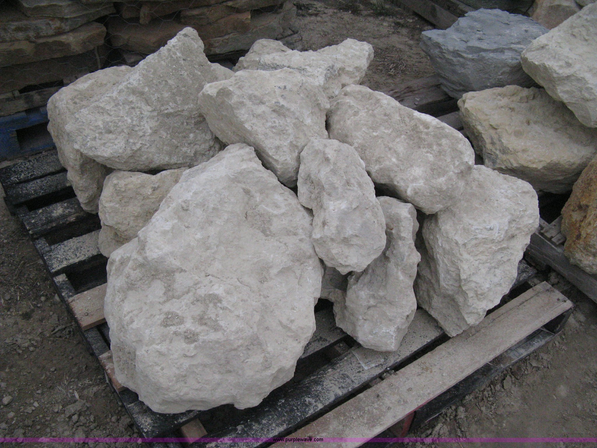 3 pallets of various size limestone boulders in Wichita, KS Item AK9067 sold Purple Wave