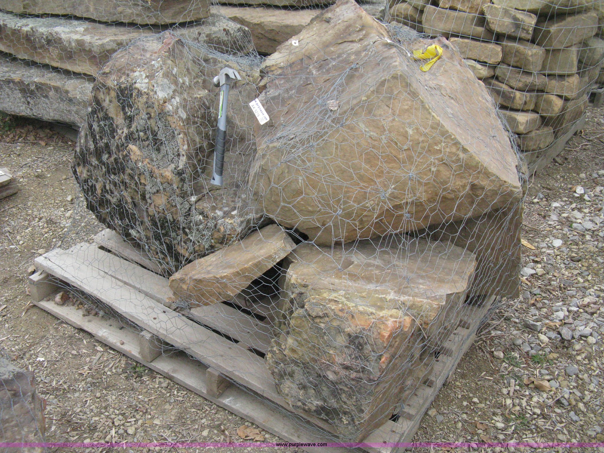 A pallet of moss rock boulders in Wichita, KS Item AK9216 sold