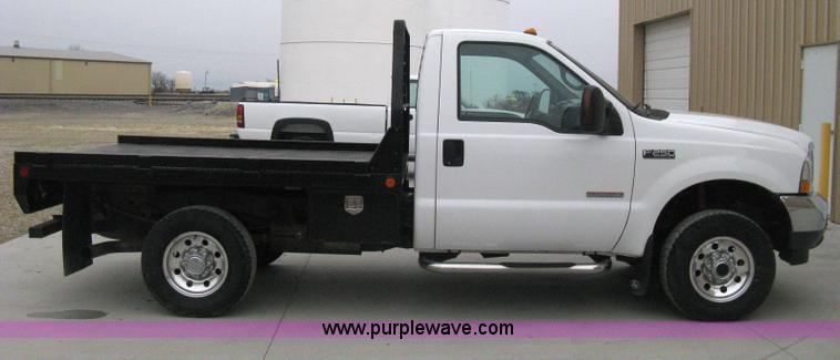 image for item E3082 2004 Ford F250 XLT Super Duty flatbed truck