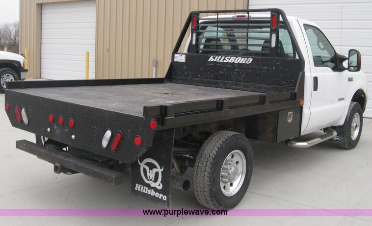 image for item E3082 2004 Ford F250 XLT Super Duty flatbed truck