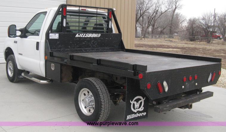 image for item E3082 2004 Ford F250 XLT Super Duty flatbed truck