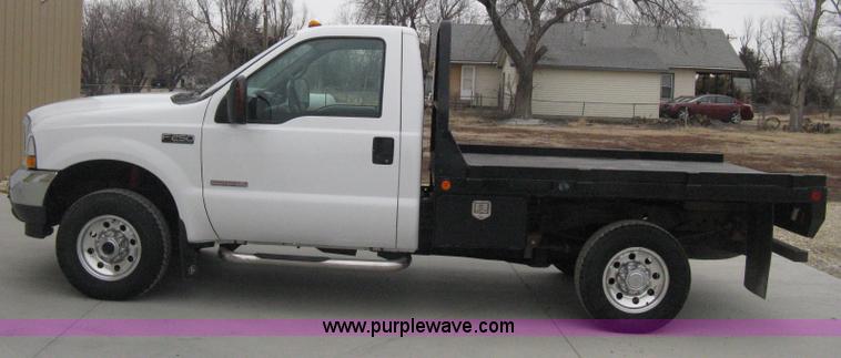 image for item E3082 2004 Ford F250 XLT Super Duty flatbed truck