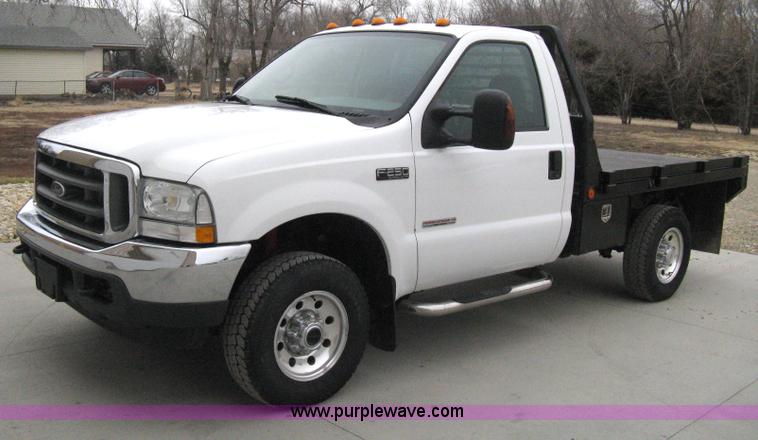 image for item E3082 2004 Ford F250 XLT Super Duty flatbed truck