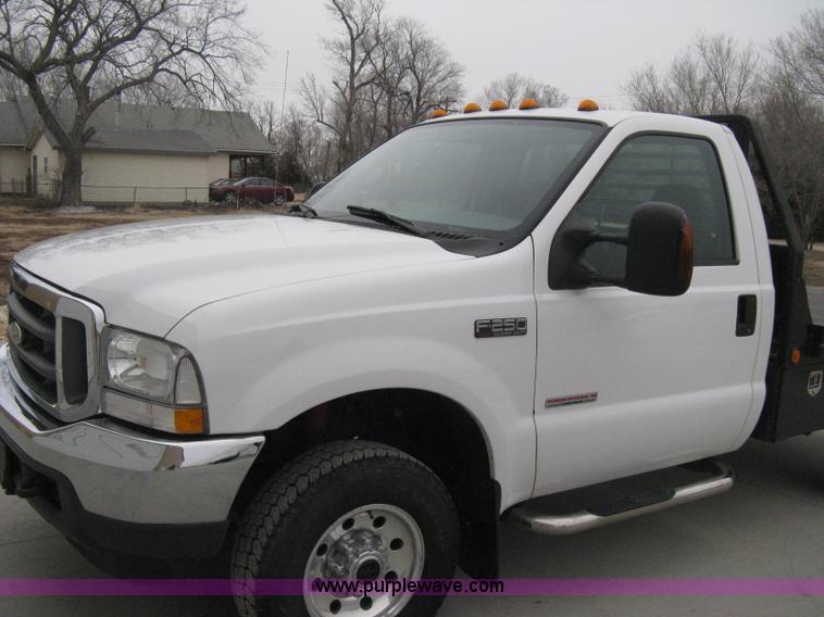 image for item E3082 2004 Ford F250 XLT Super Duty flatbed truck