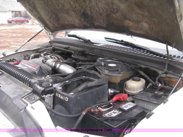 image for item E3082 2004 Ford F250 XLT Super Duty flatbed truck