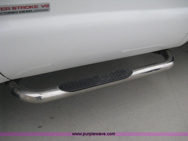 image for item E3082 2004 Ford F250 XLT Super Duty flatbed truck