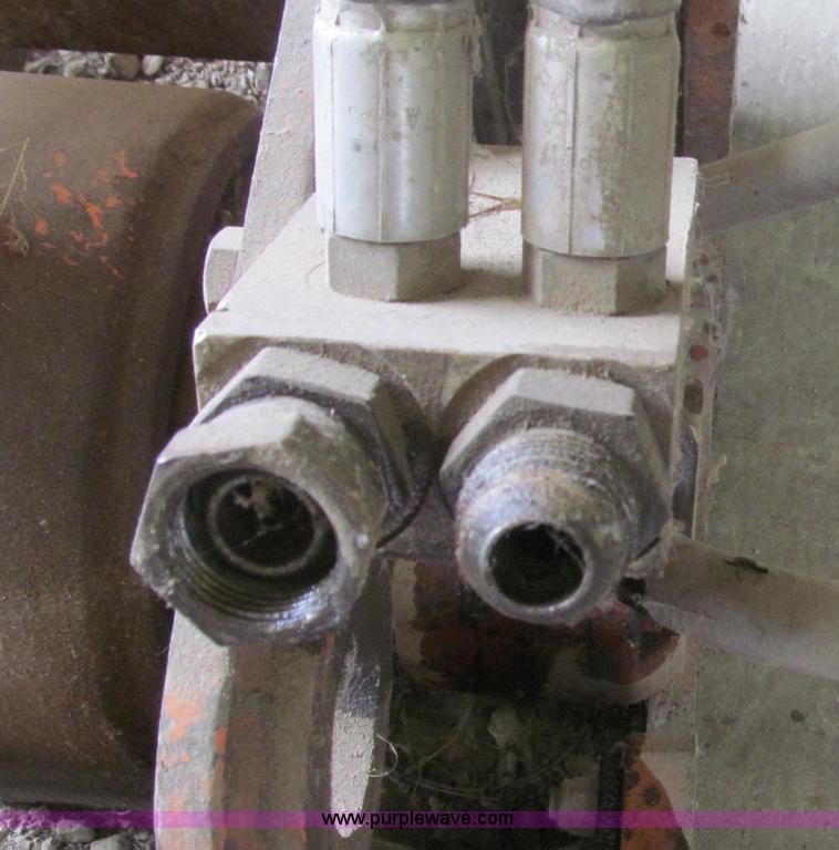 image for item O9160 Stanley hydraulic dirt tamper backhoe attachment