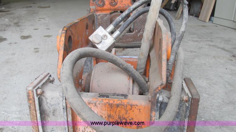 image for item O9161 Stanley hydraulic dirt tamper backhoe attachment