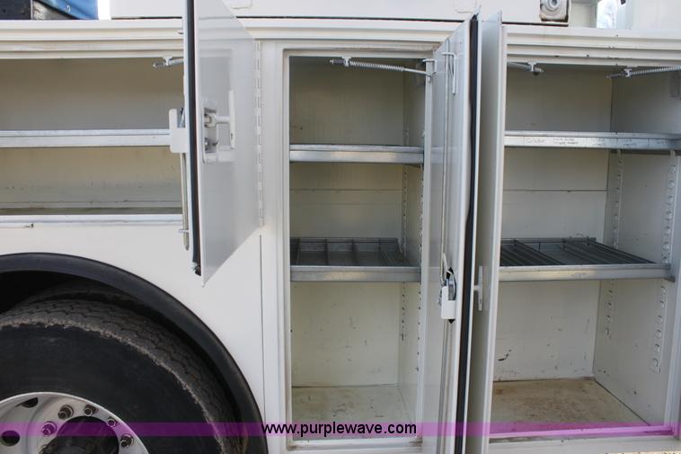 image for item E8416 1999 Freightliner FLD semi service truck