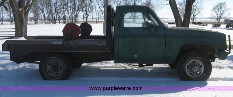 image for item E3106 1985 Chevrolet flatbed pickup truck