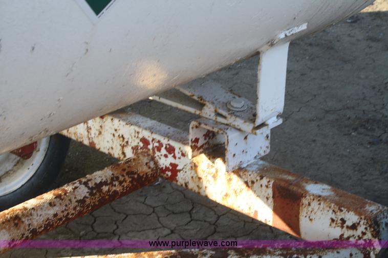 image for item F2988 1,000 gallon anhydrous ammonia tank on running gear