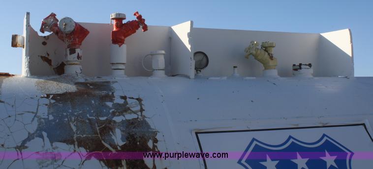 image for item F2990 1,000 gallon anhydrous ammonia tank on running gear