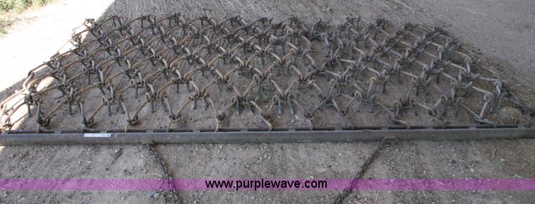 image for item T9020 11' x 6.5' drag chain harrow
