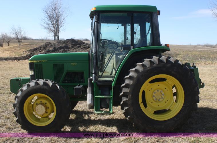 image for item V9512 2001 John Deere 6410 MFWD tractor