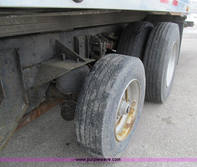 image for item D7070 2002 International 4900 roll off truck