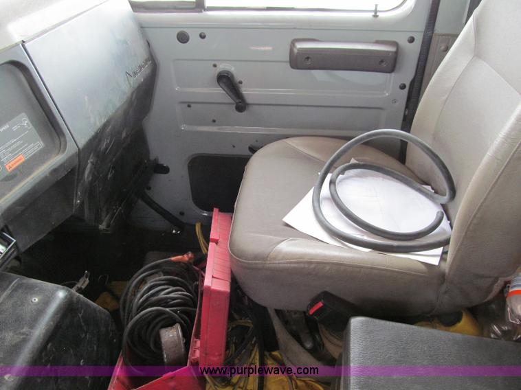 image for item D7070 2002 International 4900 roll off truck