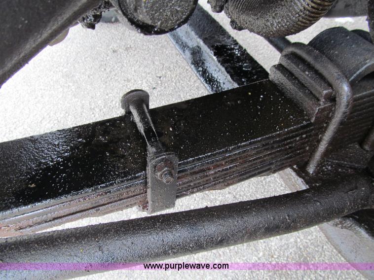 image for item D7070 2002 International 4900 roll off truck