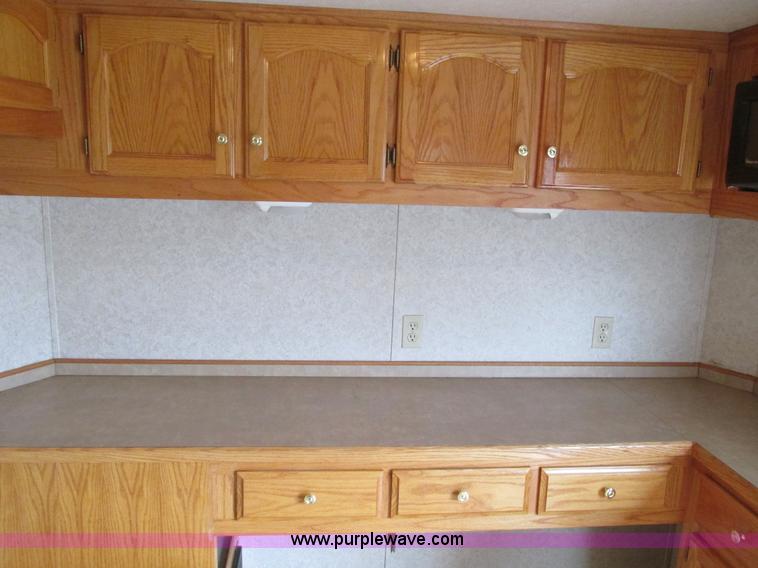 image for item F4402 2002 H&H 28' cargo trailer with living quarters