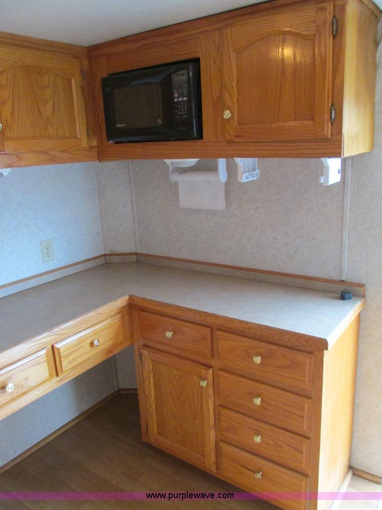 image for item F4402 2002 H&H 28' cargo trailer with living quarters