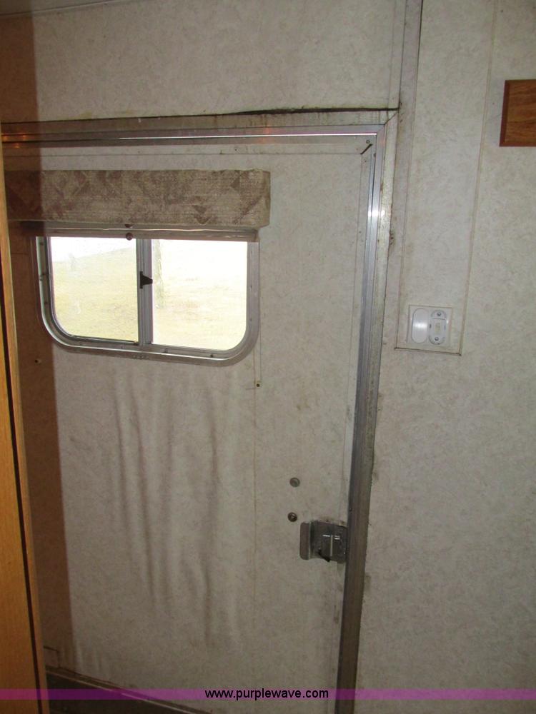 image for item F4402 2002 H&H 28' cargo trailer with living quarters