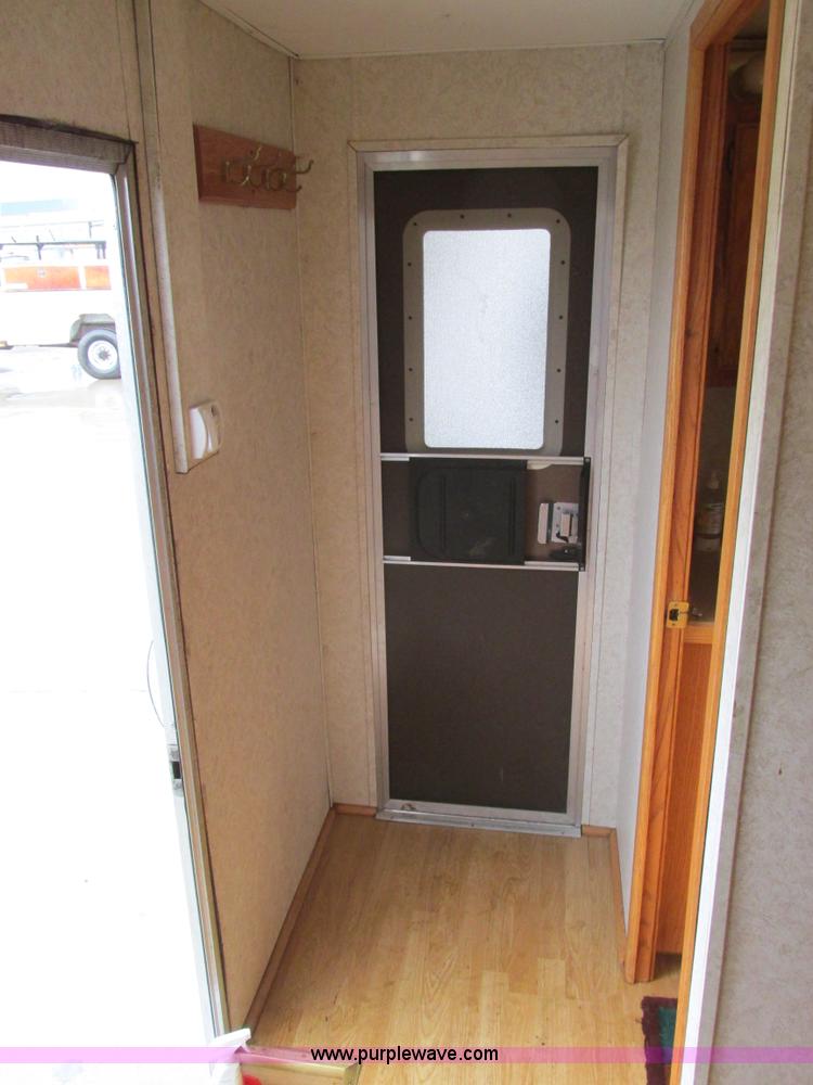 image for item F4402 2002 H&H 28' cargo trailer with living quarters