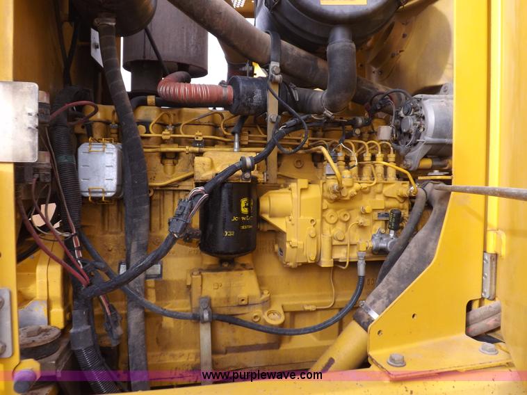 image for item F6420 1998 John Deere 770CH articulated motor grader