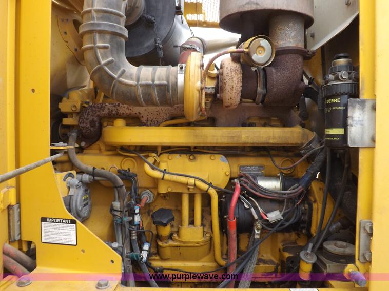 image for item F6420 1998 John Deere 770CH articulated motor grader