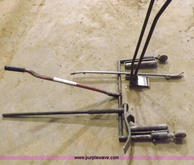 image for item J9174 Tire dolly and assorted tire repair tools