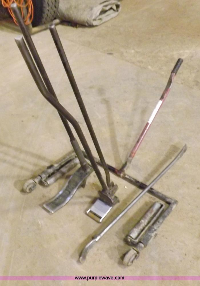 image for item J9174 Tire dolly and assorted tire repair tools