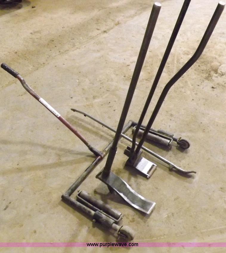 image for item J9174 Tire dolly and assorted tire repair tools