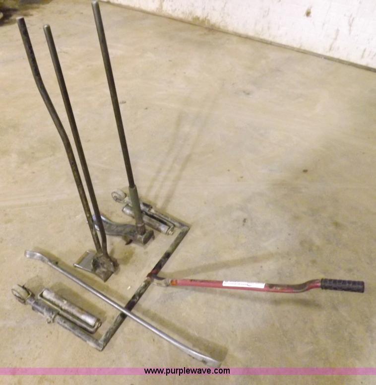 image for item J9174 Tire dolly and assorted tire repair tools