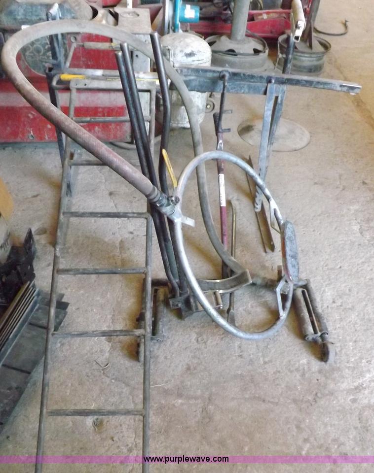 image for item J9174 Tire dolly and assorted tire repair tools