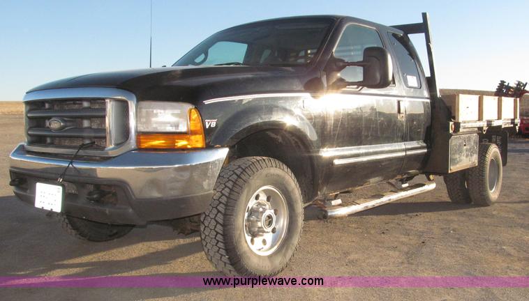 image for item B5400 1999 Ford F350 XLT SuperCab flatbed truck