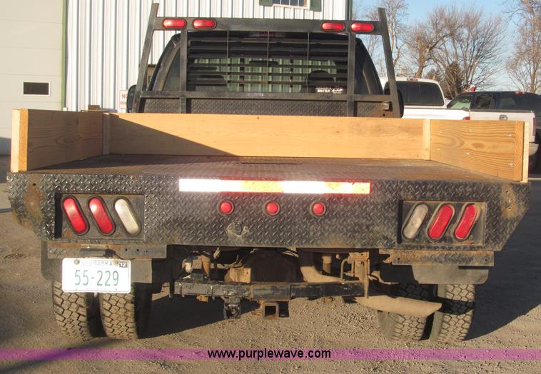 image for item B5400 1999 Ford F350 XLT SuperCab flatbed truck